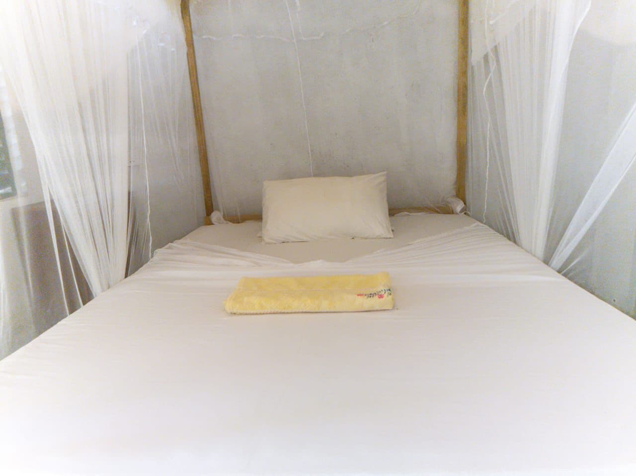 Bed White Mosquito Net Yellow Towel