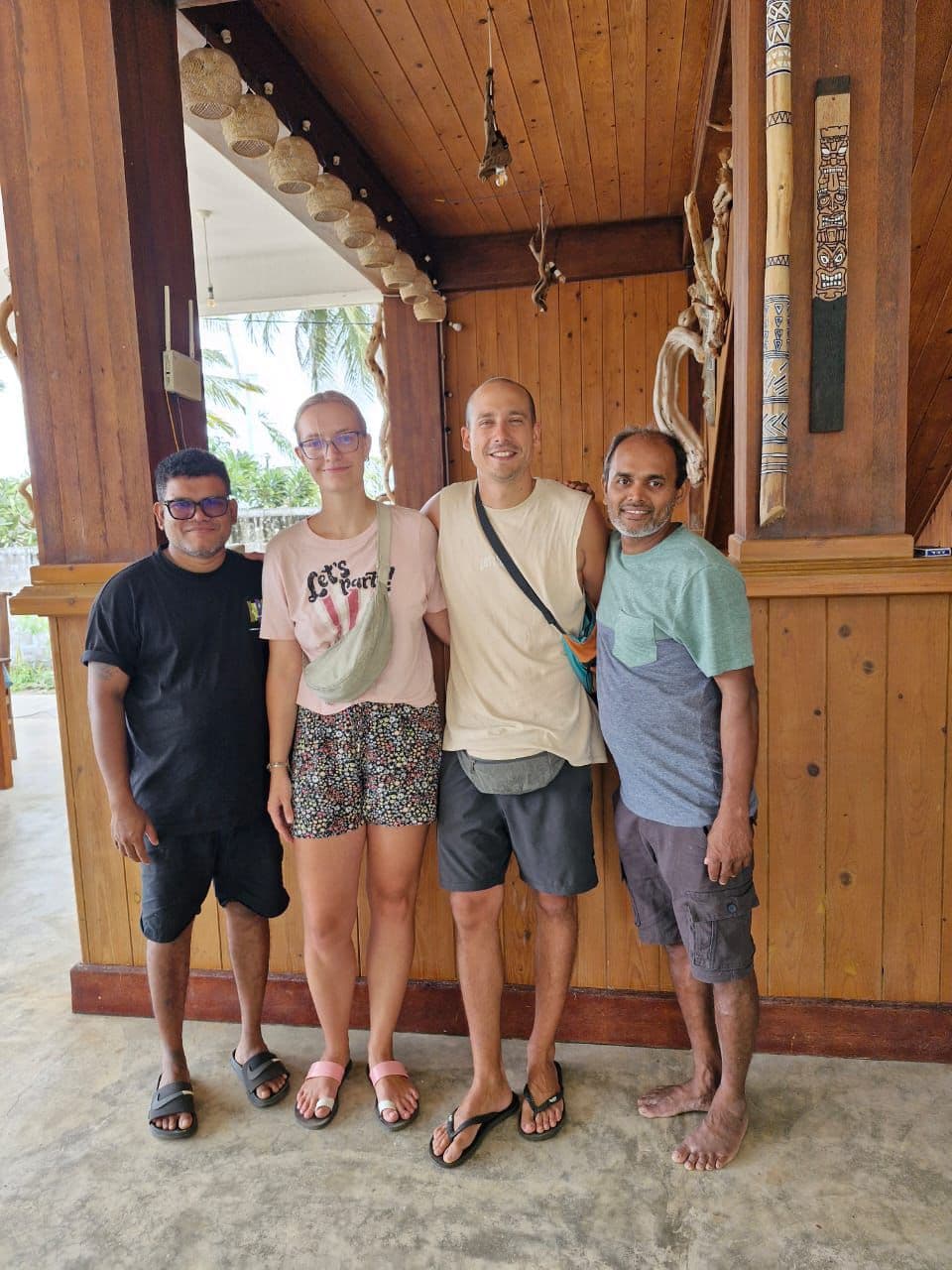 Four People Posing Wooden Lodge