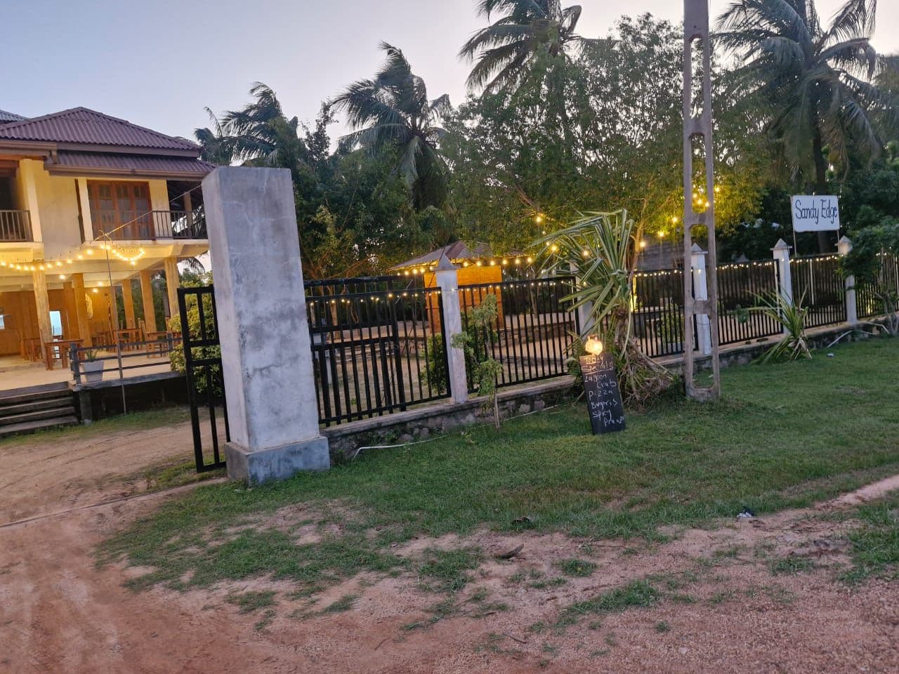 Sandy Edge Gate Sign Dusk