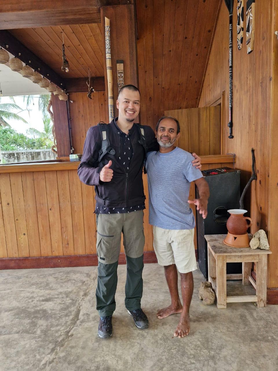 Two Men Posing Wooden Lodge