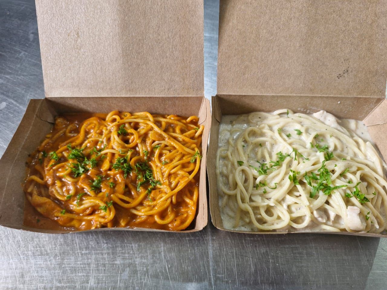 Two Noodle Boxes Red White Sauce