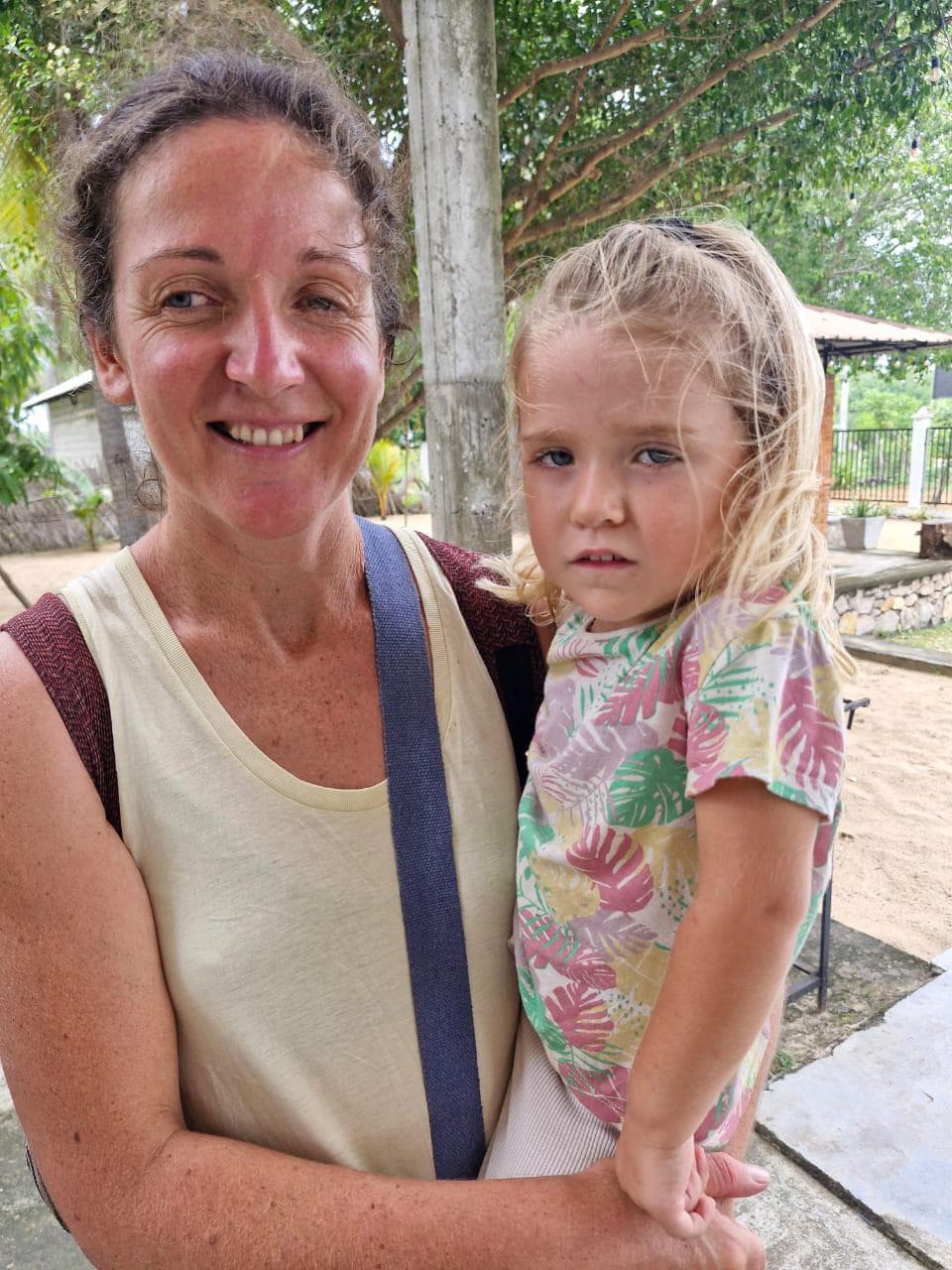 Woman Holding Blond Child