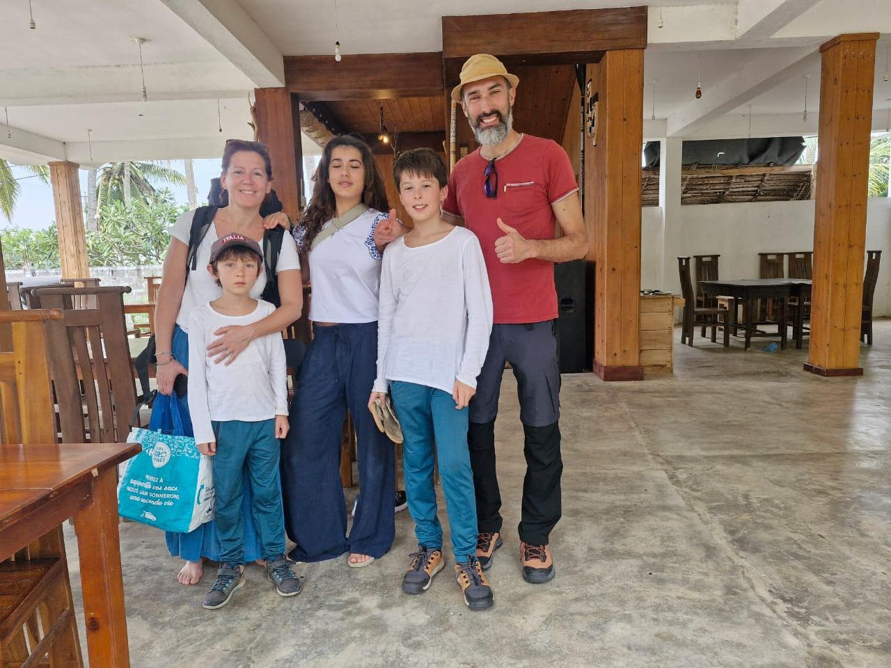Family of five enjoying the open-air restaurant